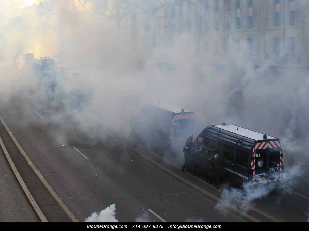 Tear gas outdoors police. Photo credit: Baudouin Wisselmann/Unsplash. Bio-One of Orange.