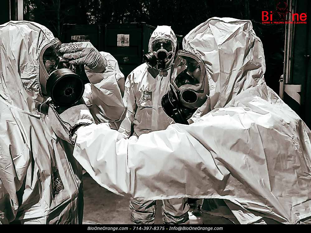 Technicians in PPE gear. Photo credit: Bio-One of Orange.