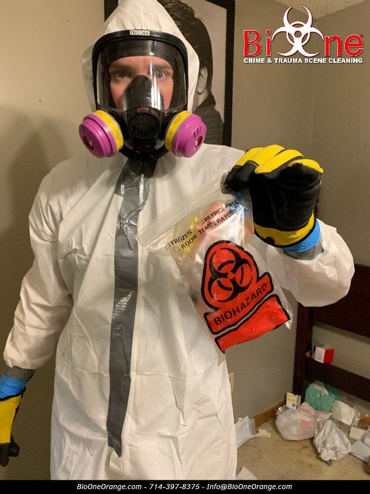 Technician holding biohazard waste bag. Photo credit: Bio-One of Orange.